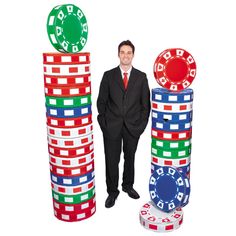 a man standing next to stacks of casino chips