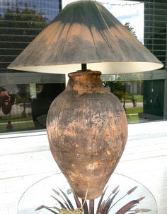 a lamp sitting on top of a glass table