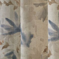 an image of curtains with blue flowers on them