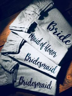 the bride and groom shirts are laid out on top of each other