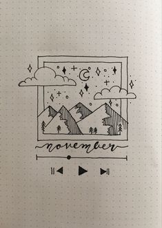 a notebook with an image of mountains and trees on the page, which reads november