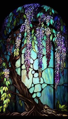 a stained glass window with purple and green flowers hanging from it's sides, next to a tree