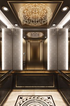 an elevator with gold and black decor on the walls, along with a rug in front of it