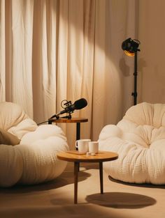 a room with two bean chairs and a microphone on the table in front of it