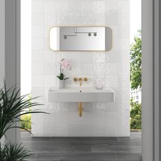 a bathroom with a sink and mirror in the wall next to a potted plant