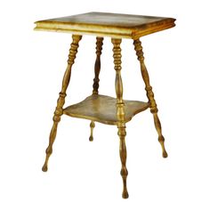 an old wooden table with two legs and a small square top on one end,