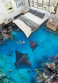 an underwater bedroom is shown with blue water and stingfishs on the floor, as well as a bed