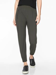 Athleta Cosmic Jogger Arbor olive (FIRST PICTURE) SIZE S #351046 EXCELLENT USED CONDITION $98.00   FIT & SIZING Semi-fitted, Mid rise Skims easily over the body for a just-right fit, Sits below the natural waist Inseam: Regular: 26" Petite: 24" Tall: 29"   PRODUCT DETAILS FOR: Commuting, working and traveling FEEL: Lightweight fabric is soft and sleek with surprising stretch FAVE: The sleek detailing at the waist creates a cinched effect without the bulk 2 POCKETS: secure front zip #351046   FAB Jogger Outfit, Best Joggers, Travel Pants, Fashion Joggers, Confident Woman, Performance Outfit, Arbor, Lifestyle Brands, Workout Pants