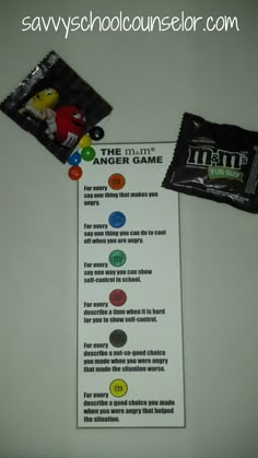 a bag of candy sitting on top of a table next to an envelope with the instructions