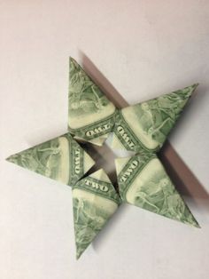 an origami star made out of one dollar bill