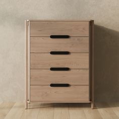 a wooden chest of drawers with black handles on the top and bottom, against a beige wall