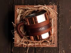 a personalized coffee mug in a wooden box