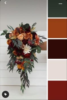 a bouquet of flowers is shown in the color red, orange and brown with green leaves