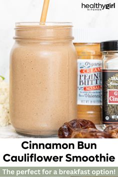 a jar filled with cinnamon bun smoothie next to other ingredients