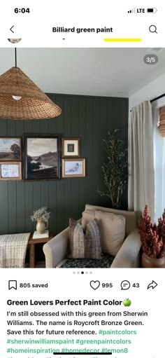 an image of a living room with green walls and pictures on the wall above it