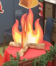 the fire is burning on the table in the classroom