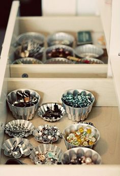 the drawer is filled with many different types of buttons