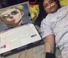 a person laying in bed with a laptop on their lap and an image of him