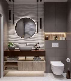 a bathroom with a toilet, sink and mirror in it's centerpieces