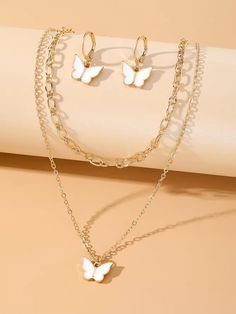 Good quality, gold with white butterflies necklace earring set, great to wear for special occasions or for gifts for holidays, anniversaries, birthdays, bridesmaids Butterflies Necklace, White Butterflies, Pendant Earring, White Butterfly, Butterfly Necklace, Butterfly Pendant, Jewellery Sets, Necklace Earring Set, Pendant Earrings