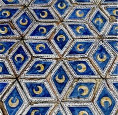 an intricate blue and gold design on the side of a building in tunis, morocco