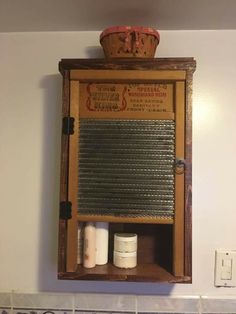 an old fashioned wooden medicine cabinet with two jars