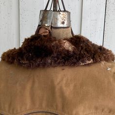 hello and welcome to the Textile Trunk! Please follow us on Instagram, we are @textiletrunk What a wonderful heavy coatA wonderful vintage French men's hunting coat dating c1970's-? The French call them Canadian coats :) ? This coat has faux fur ?? collar and inside it is lined with sheep's wool. It is certain to keep you warm!! The body is brown canvas cotton. This coat is superbly heavy, and ideal for winter use. It has several great pockets externally, and charming wooden buttons. The two lin Vintage Lined Winter Outerwear, Vintage Lined Outerwear For Winter, Vintage Winter Outerwear, Vintage Fall Outerwear With Faux Fur Lining, Vintage Outerwear With Corduroy Collar For Fall, Vintage Fall Outerwear With Corduroy Collar, Vintage Brown Winter Outerwear, Lace Apron, Hunt Coat