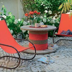 two lawn chairs sitting on top of a stone patio