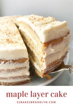 a close up of a cake on a plate with the words maple layer cake above it