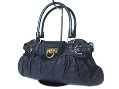 Home Description About Payment Shipping New Arrivals SALVATORE FERRAGAMO Gancini Leather Black Shoulder Bag FS13597L      click to enlarge DESCRIPTION BrandSalvatore Ferragamo Made InItaly Serial Number DW-21 6324 StyleShoulder Bag MaterialLeather ColorBlack Dimensions (inches)W17.7", H9.5", D3.2" / Shoulder length 15.4" & Shoulder drop 7.1" (Approx) Dimensions (cm)W45cm, H24cm, D8cm / Shoulder length 39cm & Shoulder drop 18cm (Approx) Dimensions (inches)W17.7", H9.5", D3.2" Shoulder length 15.4 Black Bag Outfit, Autumn Fits, College Bags, Leather Pocket, Vintage Shoulder Bag, Vintage Leather Bag, Black Shoulder Bag, Balenciaga City Bag, Vintage Bags