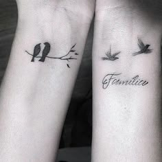 two birds sitting on top of each other's wrist tattoos