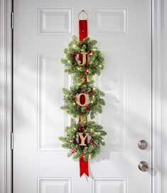 a christmas wreath hanging on the front door