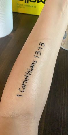 a person with a tattoo on their arm that says,'3 13 counting four '