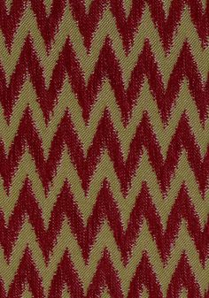 a red and yellow fabric with an interesting pattern on it's side, showing the diagonal