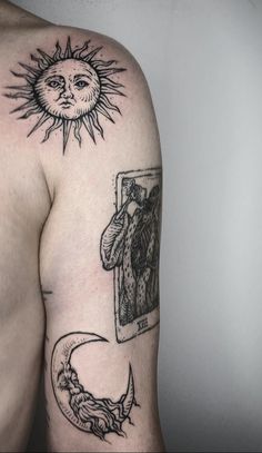 a man's arm with tattoos on it and an image of the sun above him