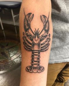 a black and white tattoo of a lobster