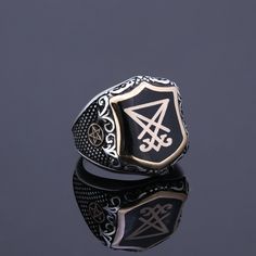 Mens fabous Sigil De Lucifer symbol ring %100 handmade customization available item. Silver devil symbol pentagram signet ring. You can contact with me for other gothic symbols and i can work on item with your special symbol for you. CUSTOMIZATION: I can make the same ring of 10K GOLD ,14K GOLD, 18K GOLD or 22K GOLD at an extra cost. Also i can make same ring with different top and side symbols. Please contact me for details if you're interested. Ring Details Metal: 925 Sterling SILVER and Bronz Lucifer Symbol, Devil Symbol, Gothic Symbols, Demon Symbols, Mens Ruby Ring, Sigil Of Lucifer, Rings Goth, Mens Turquoise Rings, Onyx Ring Men