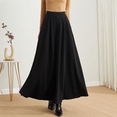 "★★ FEATURES * Polyester long skirt * Two side seam pockets * Right zipper closure * pleated detail * Plus size full skirt * A Line Skirt * Perfect for Winter, autumn, spring * Dry clean ★★ The model is 170 cm (5′ 7″) tall with a 80 cm (31.5\") bust, 66 cm (26\") waist. She is wearing the skirt in size XS. ★★ Bespoke Order Service If you Request other color Request the length Your height is not between 155 cm- 172 cm Your weight is over 75 kg I can do it for you, It will need some extra fee depe Non-stretch Full Maxi Skirt, Non-stretch Lined Maxi Skirt, Solid Non-stretch Lined Maxi Skirt, Winter Wide-leg Solid Color Skirt, Winter Wide Leg Solid Color Skirt, Black A-line Lined Skirt, High Waist Gathered Skirt, Winter A-line Solid Color Bottoms, Winter A-line Bottoms In Solid Color