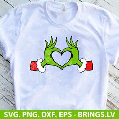 a t - shirt with two hands in the shape of a heart and holding christmas stockings