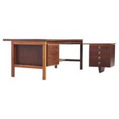 a wooden desk with two drawers on each side