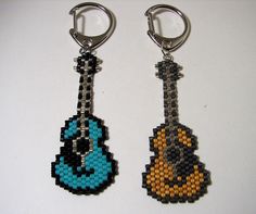 two keychains made to look like pokemons with different colors and designs on them