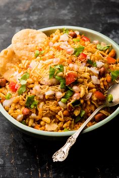 a bowl filled with rice, beans and vegetables