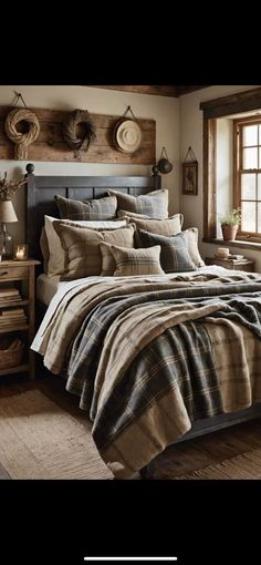 a bed with plaid comforter and pillows in a room