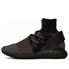 The Adidas Tubular Doom PK 'Core Black' is a stylish and modern take on a classic sneaker. The Primeknit upper in a two-tone geometric pattern is combined with a sock-like bootie that hugs the ankle for a comfortable and supportive fit. The iconic Three-Stripes are translated into a lateral cage and laced up in black. The forward-facing pull tab and counter add subtle branding to this already stand-out sneaker. The Tubular sole offers support and style in one package. (SNKR/Unisex) Adidas Tubular Doom, Adidas Tubular, Classic Sneakers, Pull Tab, Bootie, Two Tone, Geometric Pattern, Stripes, Lace Up