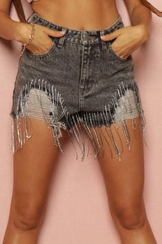 The Denim Shorts with Jewel Fringe are a bold and stylish choice for those who love to make a statement. Crafted from durable denim fabric, these shorts offer both comfort and durability. The standout feature is the jewel fringe detail, which adds a touch of glamour and edge to the classic denim design. Perfect for summer festivals, concerts, or casual outings, these shorts can be paired with a simple tee or tank top for a fun and eye-catching look. Whether you're hitting the beach or exploring the city streets, the Denim Shorts with Jewel Fringe are sure to turn heads and spark conversations. Trendy Denim Blue Bottoms With Fringe, Denim Shorts For Night Out, Denim Jean Shorts For Night Out, Party Cutoff Denim Shorts, Summer Party Cutoff Bottoms, Trendy Denim Bottoms With Fringe, Trendy High Rise Fringe Shorts, Trendy Fringe Shorts, High-waisted Denim Fringe Shorts