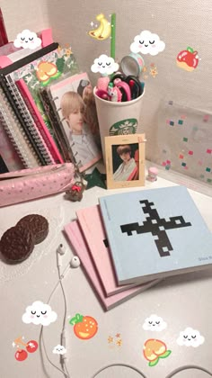 a desk with books and pictures on it