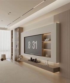 a living room with a large tv mounted on the wall and an entertainment center in front of it