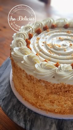 a cake with white frosting on a plate