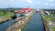 a large cargo ship passing through a lock