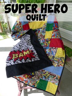 a quilt with the words super hero quilt on it